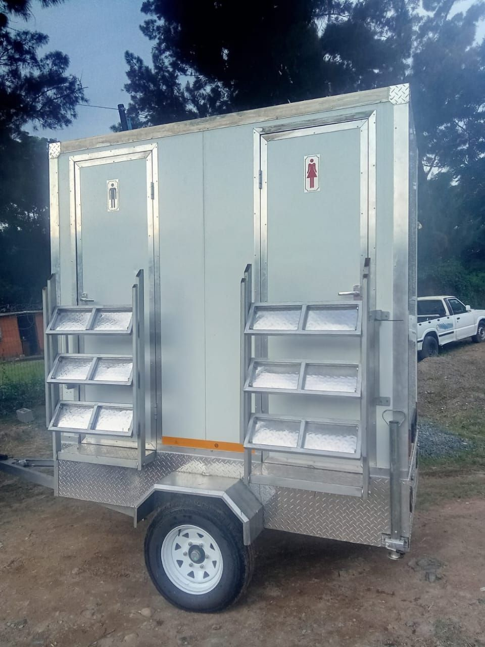 Completed twin-door VIP mobile toilet trailer with folding steps